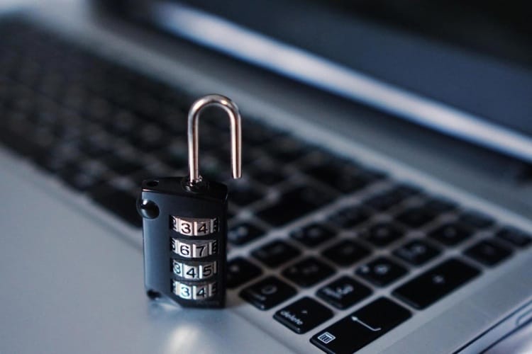 Combination lock sitting on laptop keyboard